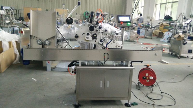 China 'n hoë spoed klein ronde blikkies etiket gom masjien, oog swart bottel etiket plakker masjien vir skoonheidsmiddels verskaffer